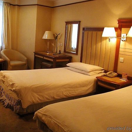 Power Hotel Harbin Habitación foto